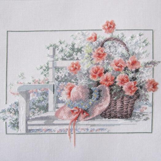 Картина вышитая крестиком Скамейка с корзиной цветов
