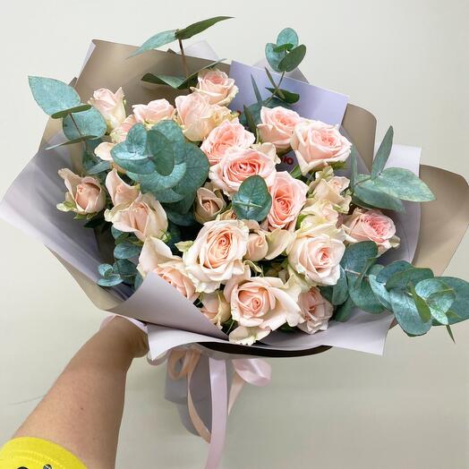 Bouquet of pink bush roses with eucalyptus