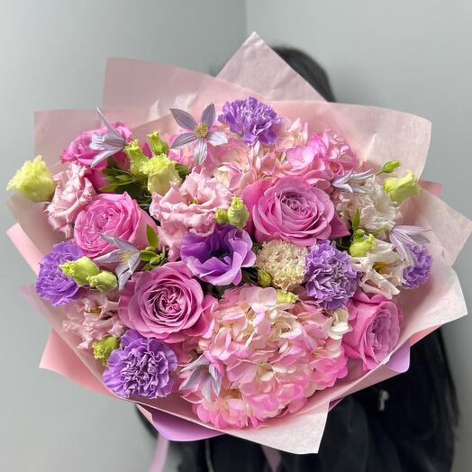 Delicate bouquet with pink peony-shaped roses, hydrangea and lavender dianthus