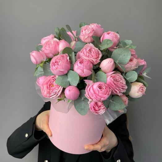 Peony-shaped bush roses in a delicate pink box with eucalyptus