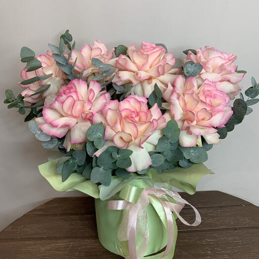 A composition of delicate French Esperance roses with eucalyptus