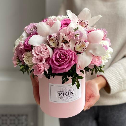 A box with pink roses and white orchids