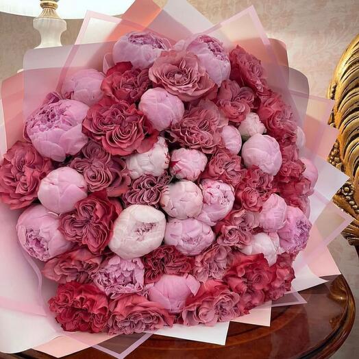 A huge bouquet with luxurious peonies and peony-shaped roses