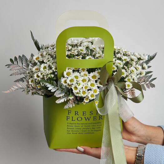 Chrysanthemums in a stylish handbag