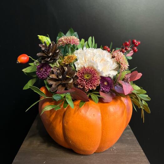 Autumn flower arrangement in a hand-made plaster gourd