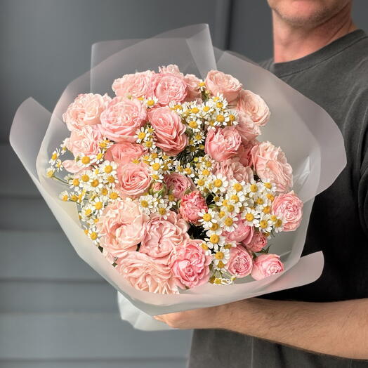 Bouquet of bushy peony-shaped bombastic rose and chamomile