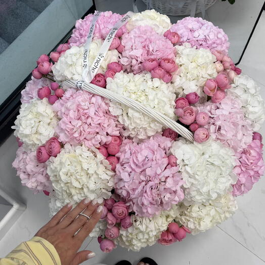 Basket with hydrangeas and roses