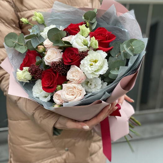 Bouquet of single-headed and bush roses, eustoma, skimmia and eucalyptus Flower ball