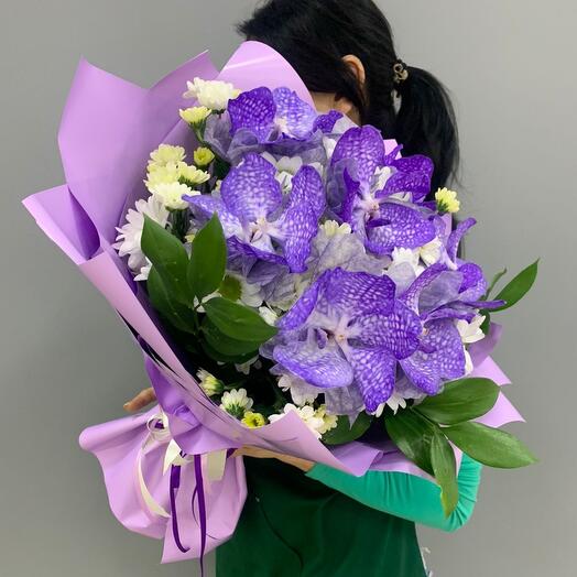 Bouquet with exotic Vanda orchid and chrysanthemum in stylish packaging