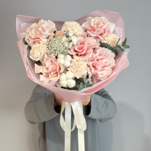 Delicate bouquet with French roses in a package