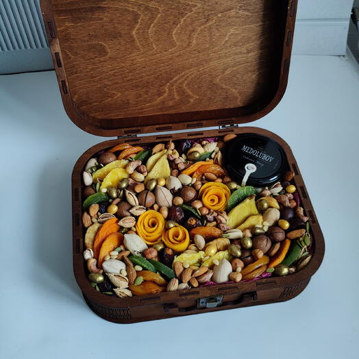 Suitcase full of nuts, dried fruits and honey