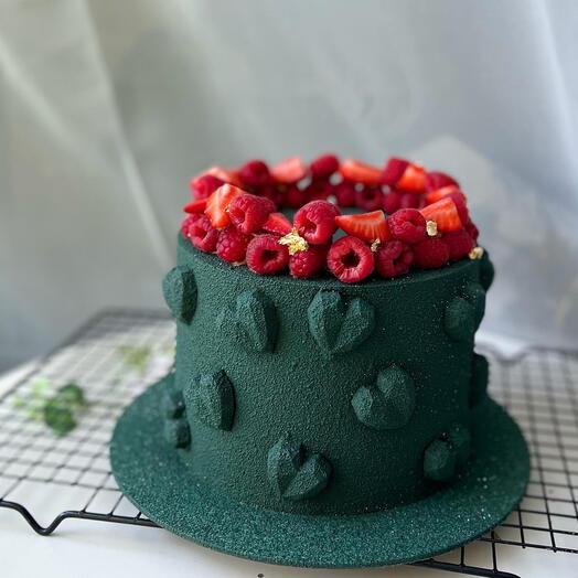 Cake with chocolate hearts and berries