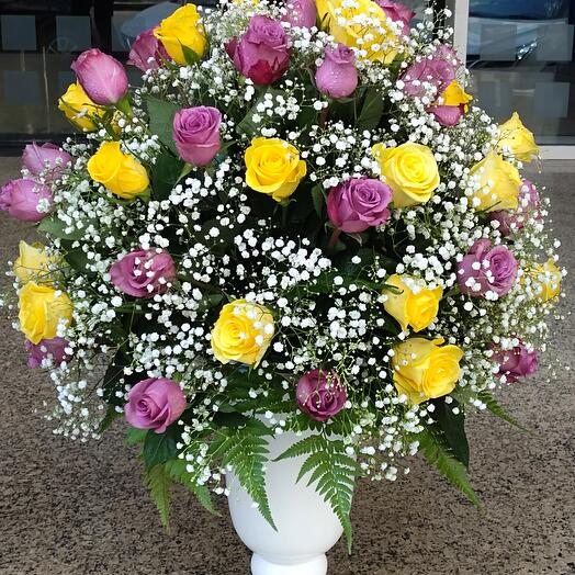 Royal arrangement; 50 stems roses   fillers in a nice ceramic vase