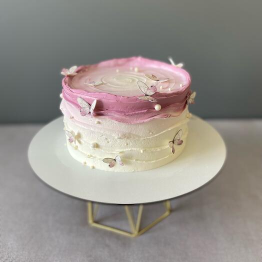 Pastel rosa con mariposas