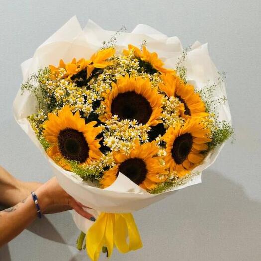 Sunflowers with wild white daisies in a bouquet