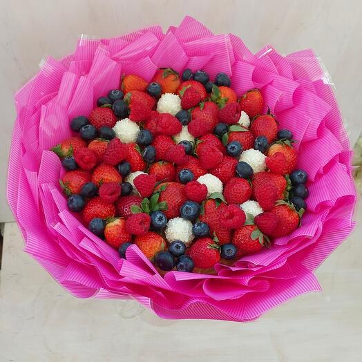Bouquet of strawberries and raffaello with different berries