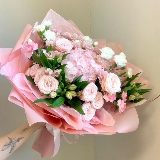 Charm is a combined bouquet of hydrangeas, bush roses, and dianthuses