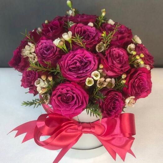 Crimson roses in a box