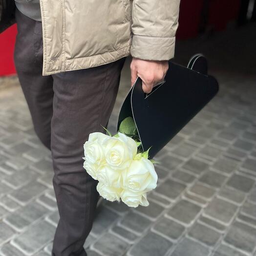 White roses in a carrier