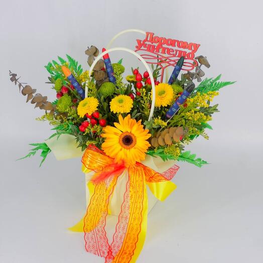 A bouquet of flowers in a handbag as a gift to a dear teacher