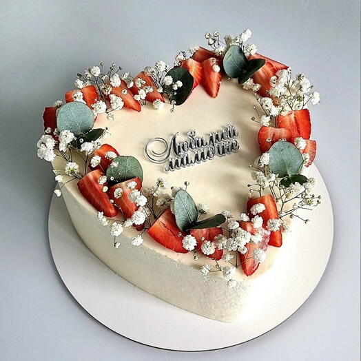 3 kg cake "Red velvet with strawberries in the shape of a heart, decorated with strawberries, greens, gypsophila with the inscription"