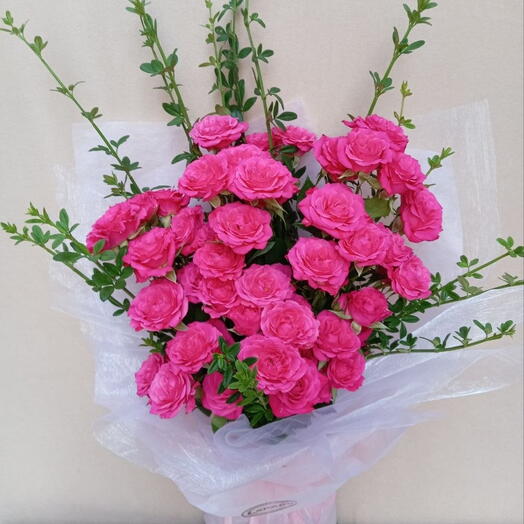 A lush pink bouquet of 7 spray roses