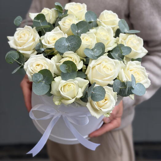 White roses with eucalyptus in a box