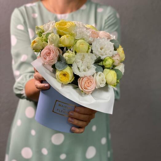 Flowers in a designer box: peony roses and fragrant eucalyptus