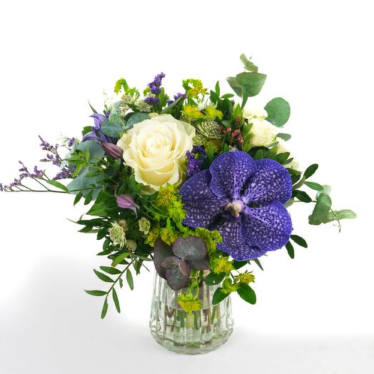 White And Blue Flowers in Small Vase