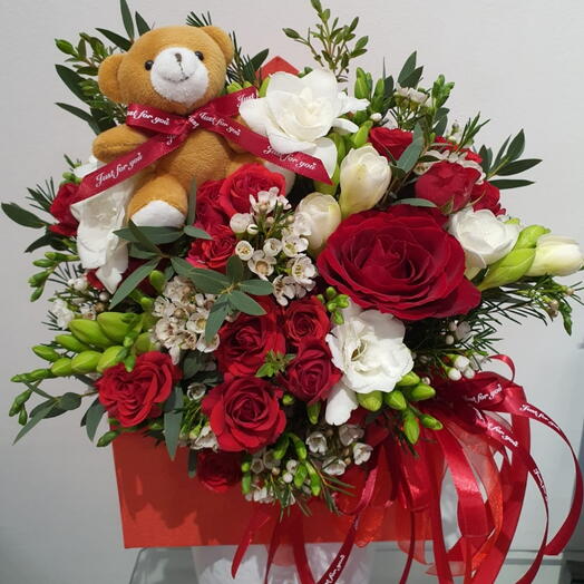 Flowers in a box with bear