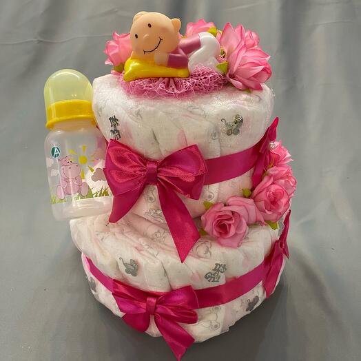 A diaper cake for the birth of a girl