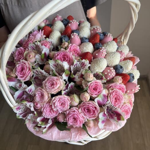 Basket with fresh flowers and chocolate-covered strawberries