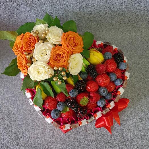 Heart of chocolate, berries and flowers
