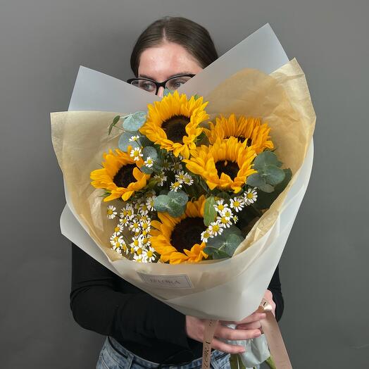Bouquet of sunflowers, tanacetum and eucalyptus