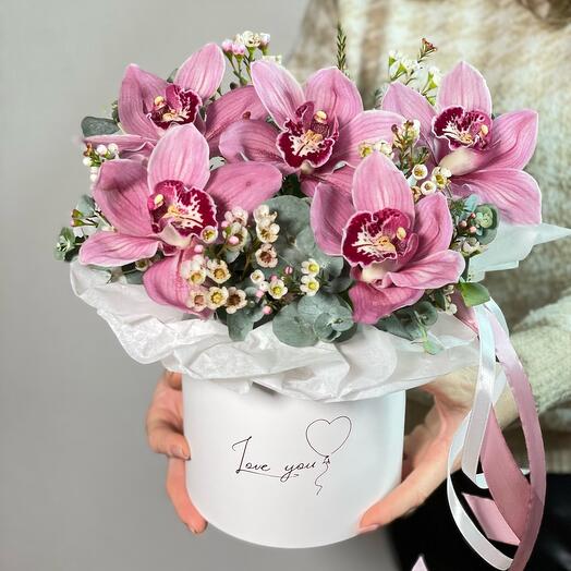 Box with orchids and waxflover