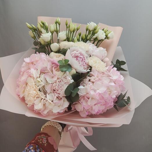 Delicate fragrant bouquet of peonies and hydrangeas