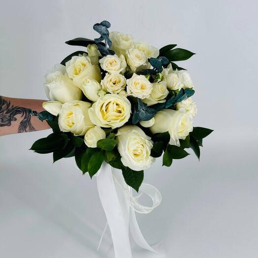 Flowers white bush roses in a bouquet for the bride