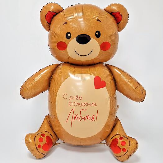 A large teddy bear balloon with an inscription