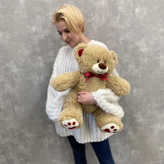 Oso de peluche suave con lazo rojo
