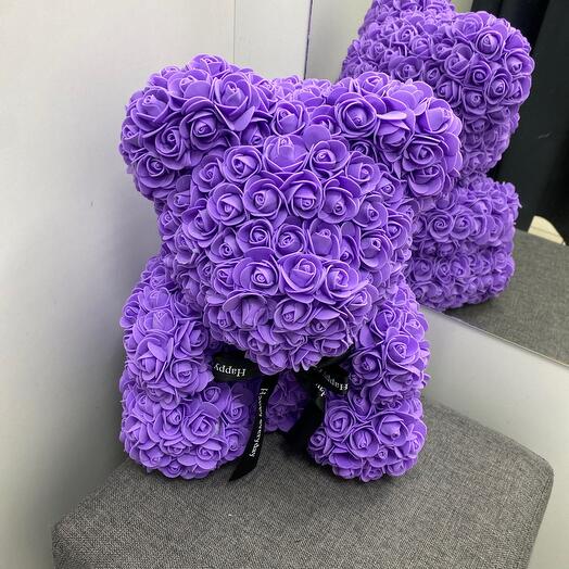 Teddy bear made of purple roses