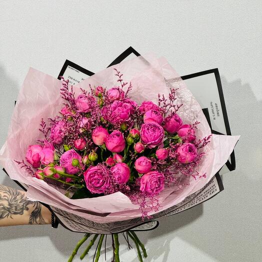 Stylish bouquet of bright pink bush roses