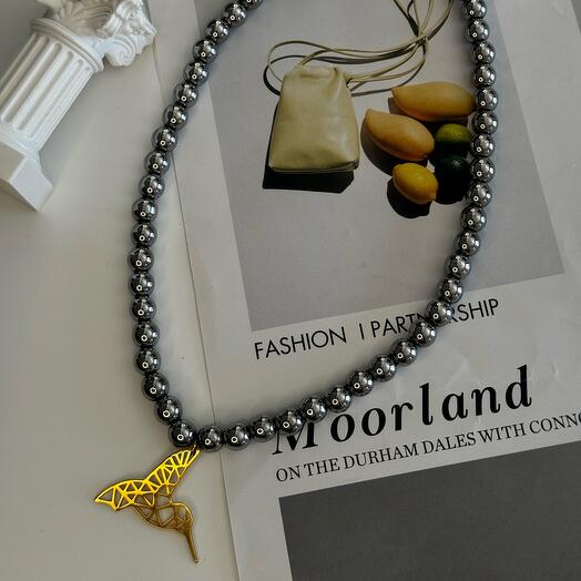 Necklace made of natural Hematite stone with pendant golden Hummingbird