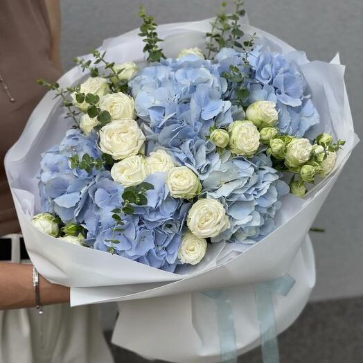 Bouquet of blue hydrangeas and white bush roses