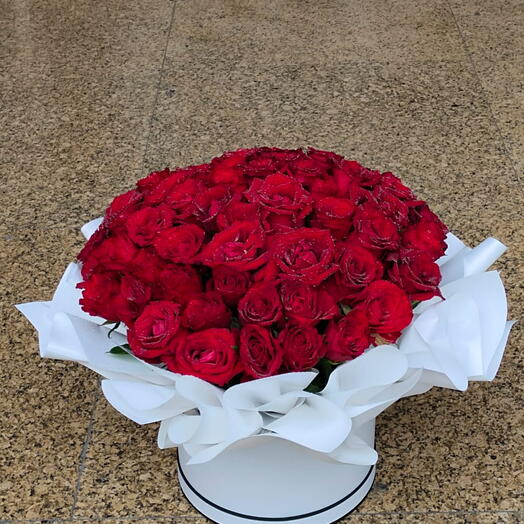 Red in White:60 Stems of red roses in a nicely arranged with paper in white round box