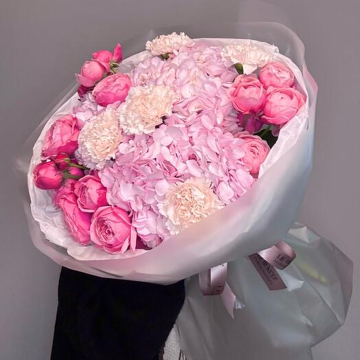 Delicate bouquet of hydrangeas, peony-shaped roses and dianthus
