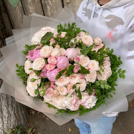 A mix of peonies, bush roses, hydrangeas and blueberries