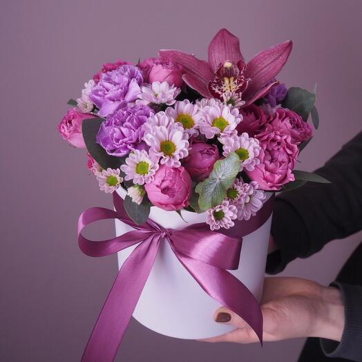 An orchid in a hatbox