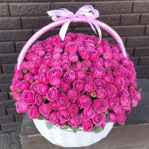 Bouquet of pink peony bush roses in a basket