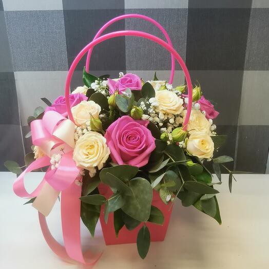 Flowers in a handbag with a Moscow rose