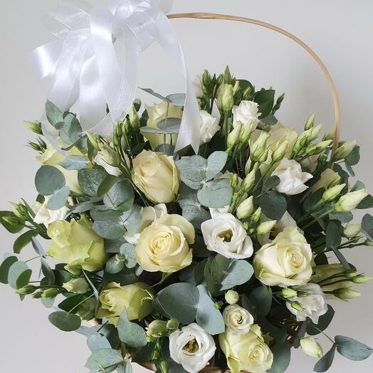 Flowers in a basket in white tones